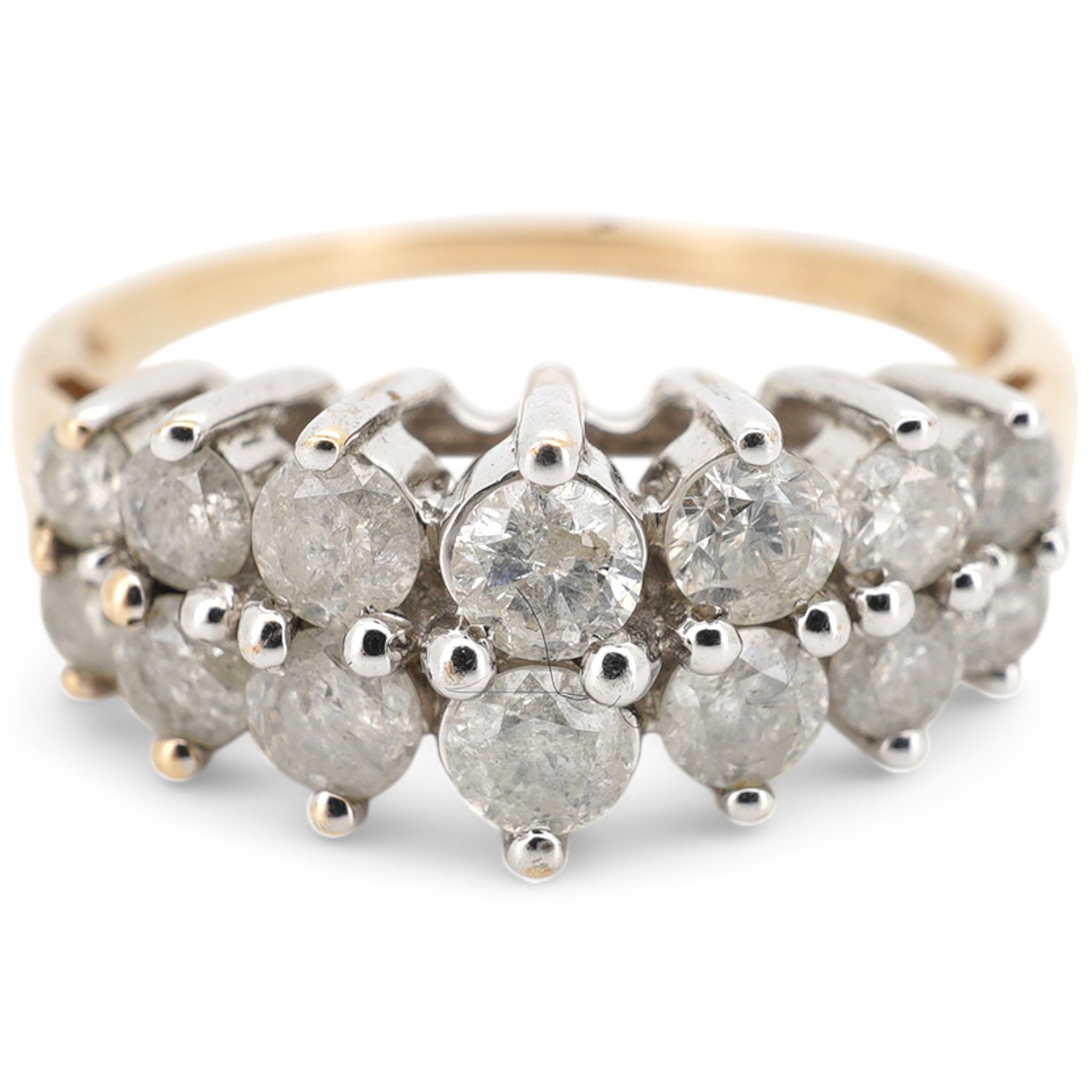 A modern 9ct gold and diamond half hoop ring, set with two graduated rows of seven diamonds, size M/N, gross weight 3.1 grams. Condition - fair to good